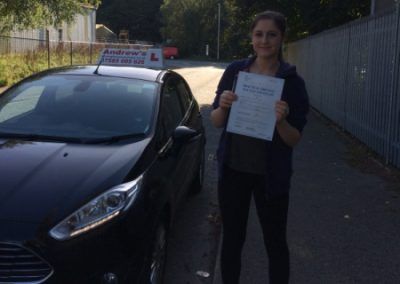 Beth with her driving test pass papers in North Wales