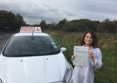 Alice in North Wales standing by ford fiesta after passing the driving test