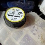 Coolant container location in Ford Fiesta engine compartment