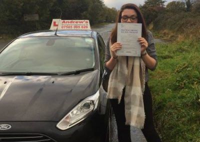 Harriet standing by Marcus's Ford Fiesta after taking her driving Lessons in North Wales