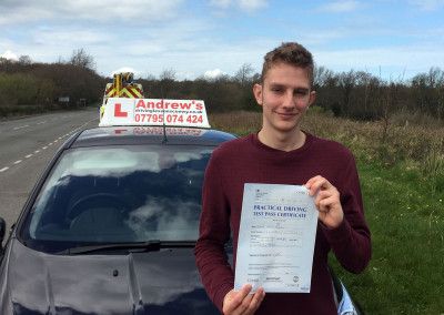 Daniel from Conwy proudly displaying his driving test pass certificate