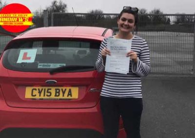 Hannah with her car after driving test