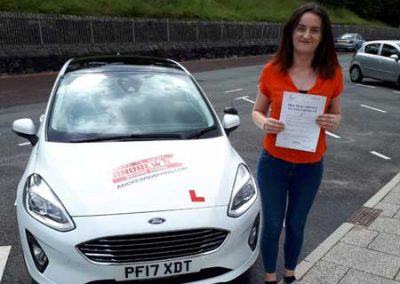 Alysia in Colwyn Bay with her driving schools car.
