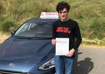 Lurence with his driving test pass certificate.
