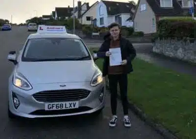 Bailey in Deganwy with the driving school car.