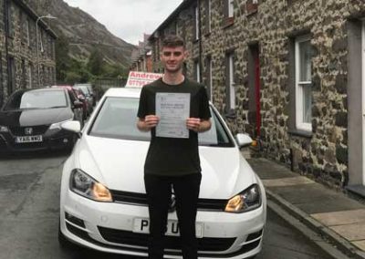 Luke in Penmaenmawr with the driving instructors car