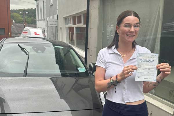 A lady in Denbigh after passing the driving test