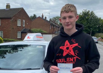 Harvey Griffiths holding a driving test pass certificate in Wrexham