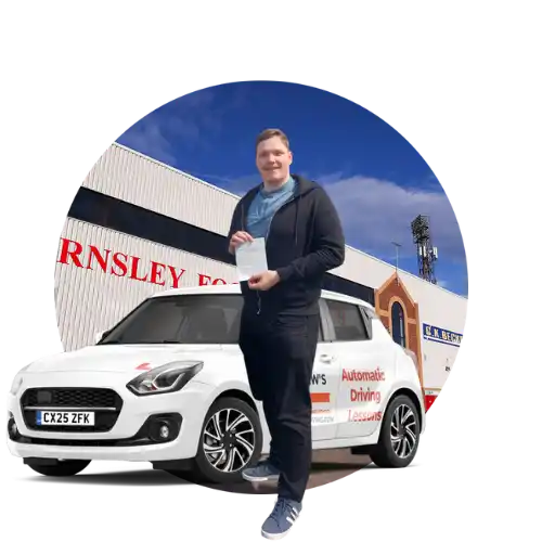 Automatic Driving Review Barnsley A new driver holding a driving test pass outside Barnsley Stadium