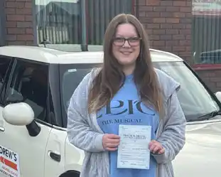 A newly passed learner with pass certificate
