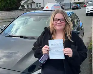 A newly passed learner with pass certificate