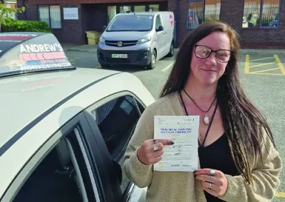 Young Lady with her new driving test pass certificate