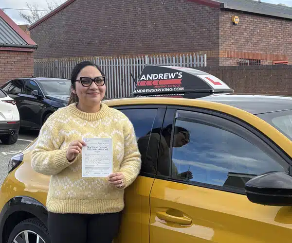 Hapreet in the Rhyl Driving Test Centre next to Paul Crafts Car