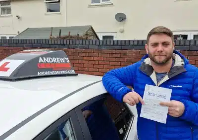 Jacob leaning on Paul Sanders car with his driving test pass