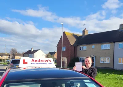 Jodie in a residential area of Abergele with Claires driving tuition car