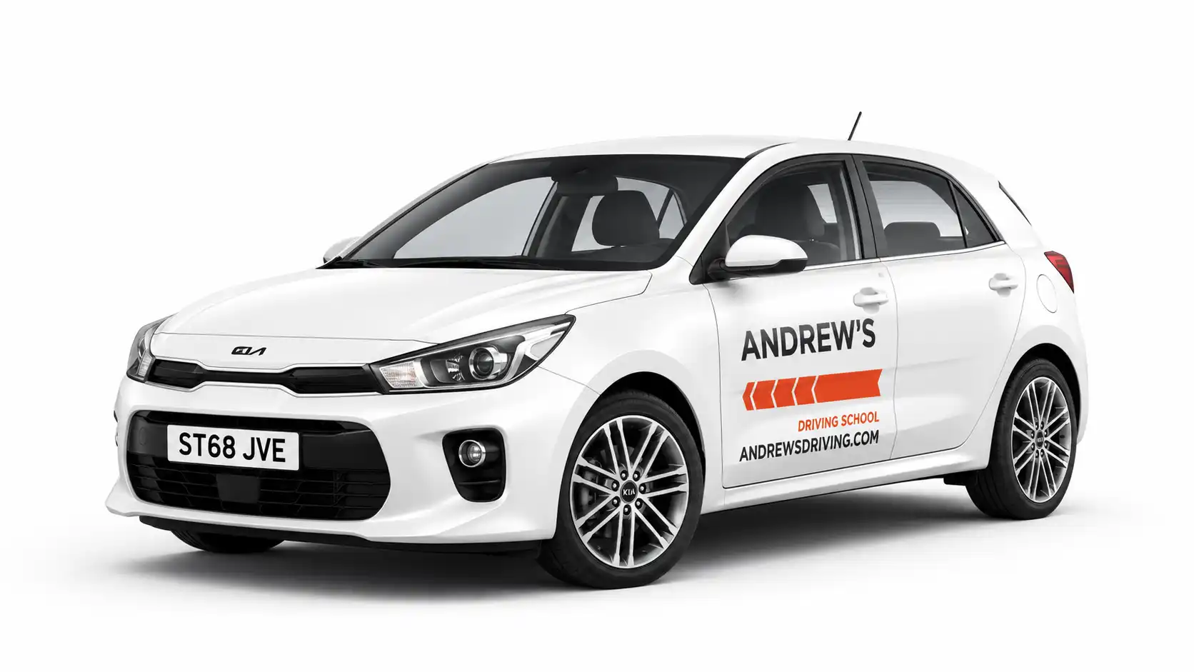 White Kia Rio branded with Andrew’s Driving School graphics
