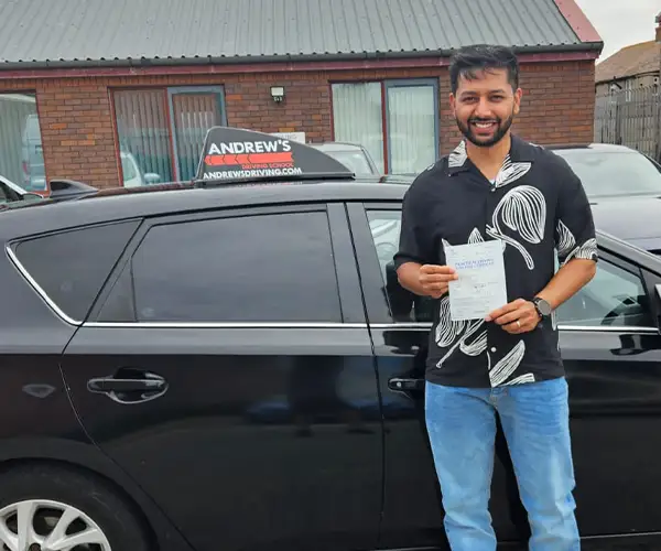 AJ at Rhyl Driving Test Centre after passing with instructor Darren from Andrew's Driving School.