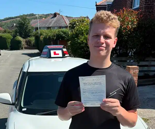 Jacob Clift in Colwyn Bay by Simons car after passing his driving test in Bangor