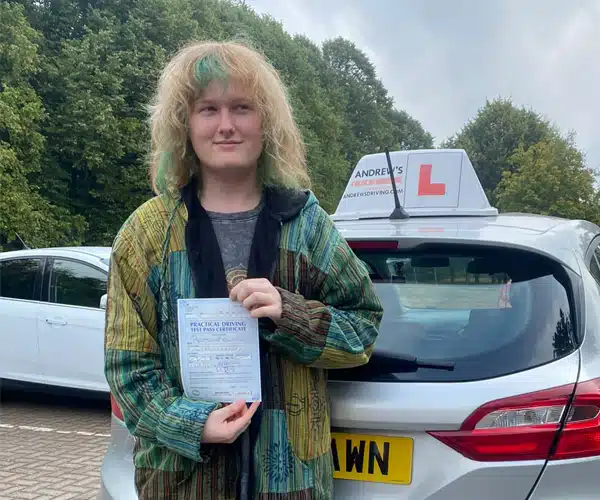Benji in Wrexham Driving Test Centre car park with Karl's Fiesta after passing his driving test first time in Wrexham