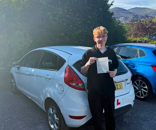 Ceiron celebrating a driving test pass with Andrew’s Driving School.