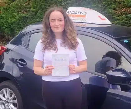 India in Rhyl showing off her new driving test pass certificate