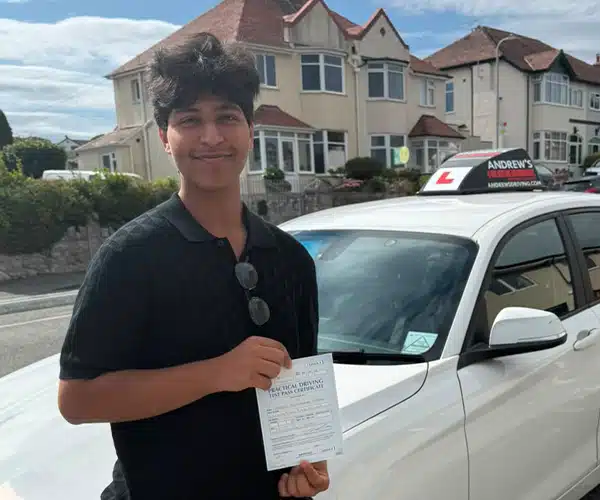 Izran celebrating a driving test pass with Andrew's Driving School.