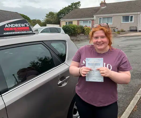 Kaysie celebrating a driving test pass in Rhyl with Andrew's Driving School.