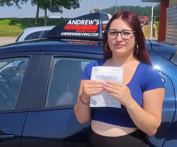 Lilly celebrating a driving test pass in St Asaph with Andrew's Driving School.