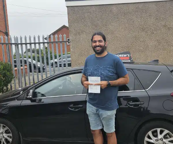 Mo celebrating a driving test pass in Rhyl with Andrew's Driving School.