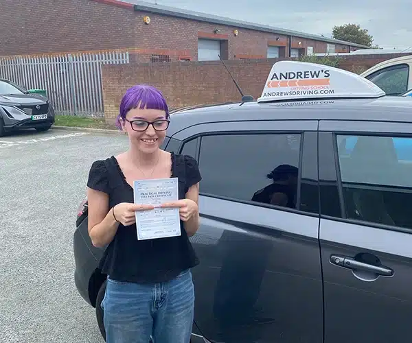 Lani Ball in Rhyl Driving Test Centre with instructor Andy Kirkham's Suzuki Swift