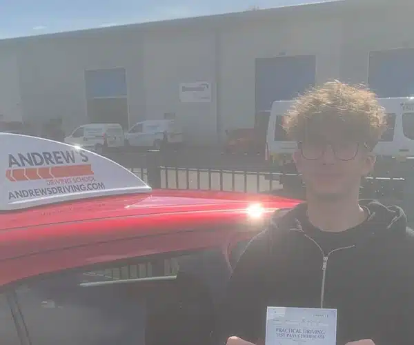 Dadu from Telford at Shrewsbury Driving Test Centre with Adrians Tuition Car and his new pass certificate