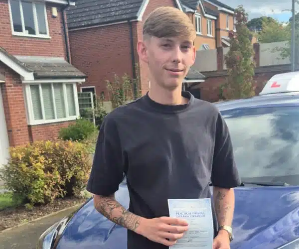 Tomos in Wrexham after passing his driving test 1st time at Wrexham Driving Test Centre