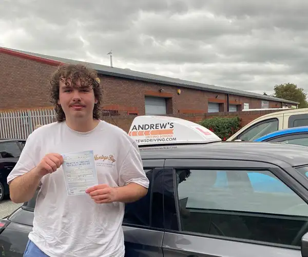 Charlie from Abergele after passing his driving test first time in Rhyl following lessons with Andy Kirkham.