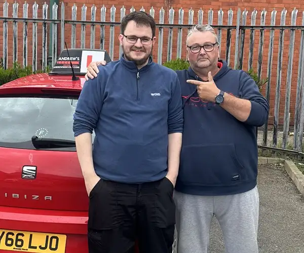John Alderton  at Rhyl  Driving Test Centre after passing part 3 with Paul Singleton