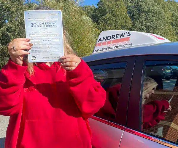 Rhiannon Jones at Wrexham Driving Test Centre after passing with Karl with no minors