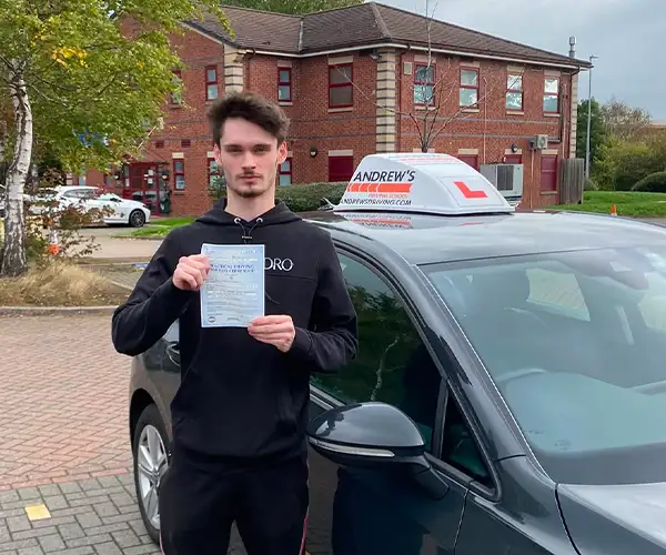 Riley Moran from Mold after passing his driving test in Chester with just three minor faults following lessons with Andy Williams.